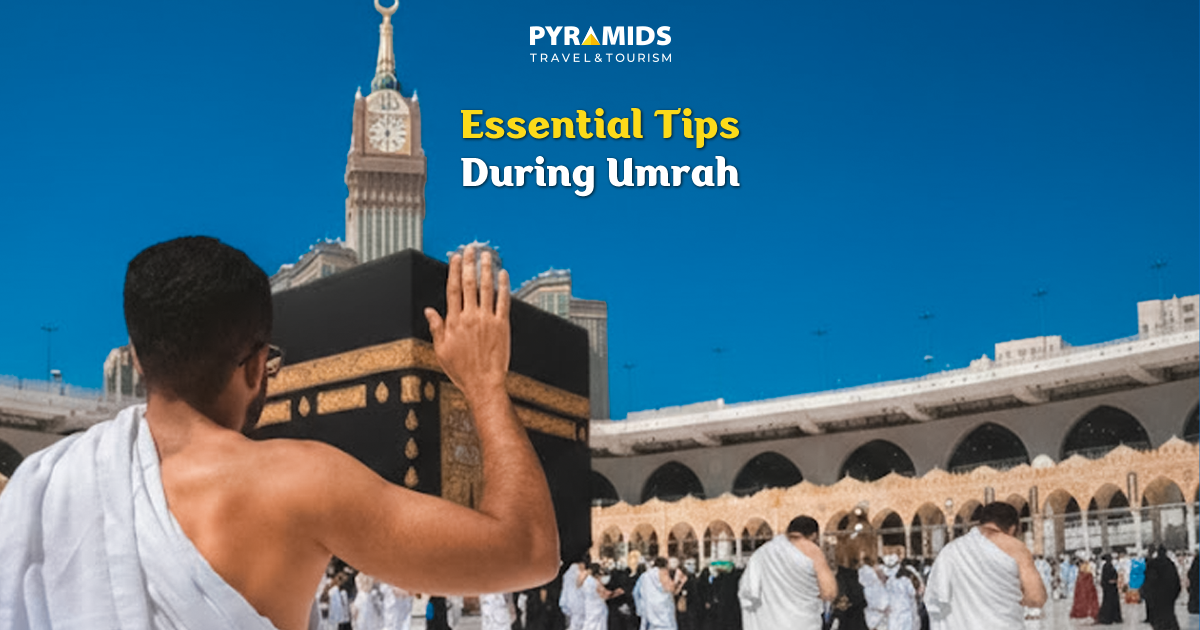 A pilgrim prays and touches the Holy Kaaba.
